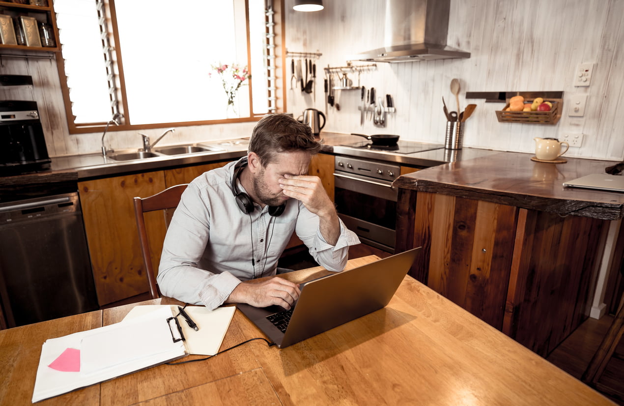 man stressed after falling for a scam by a bad transportation vendor