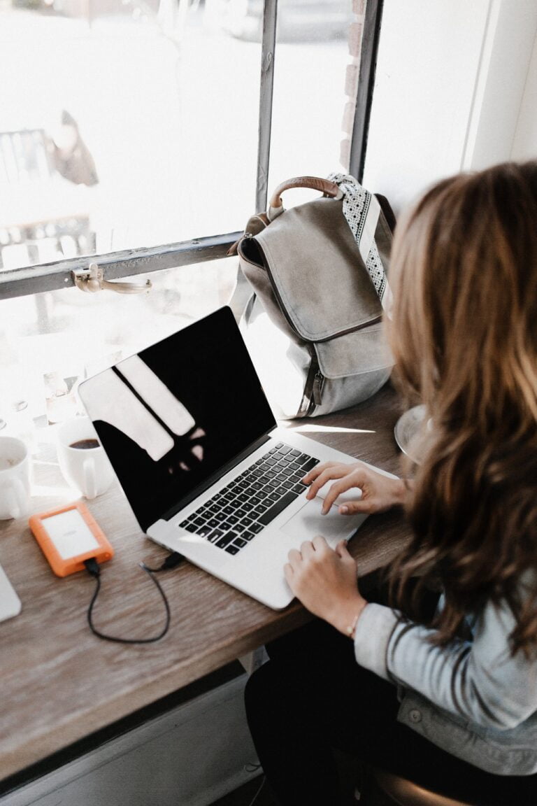 woman sitting on laptop