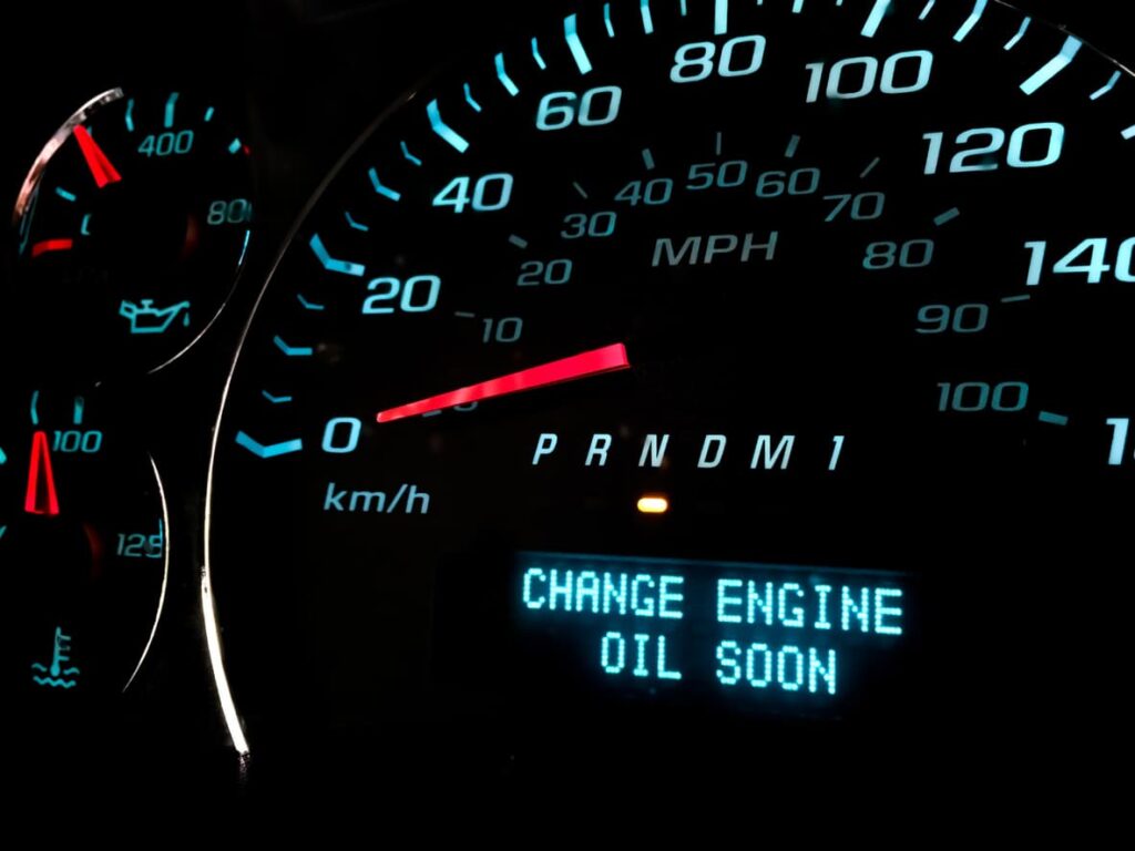 Dashboard text alert reading “Change engine oil soon.”