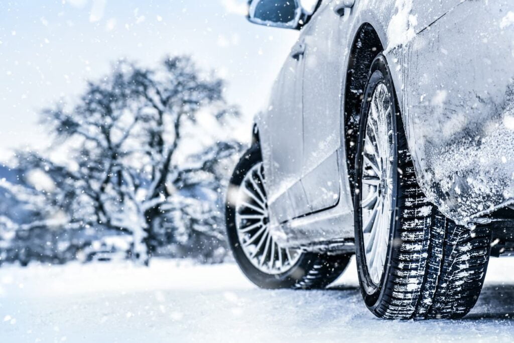 Close-up of car tires in snowy weather