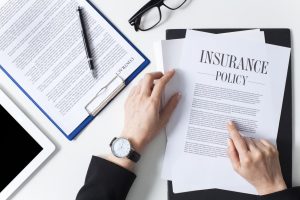a woman reading about the insurance required when shipping a car overseas.