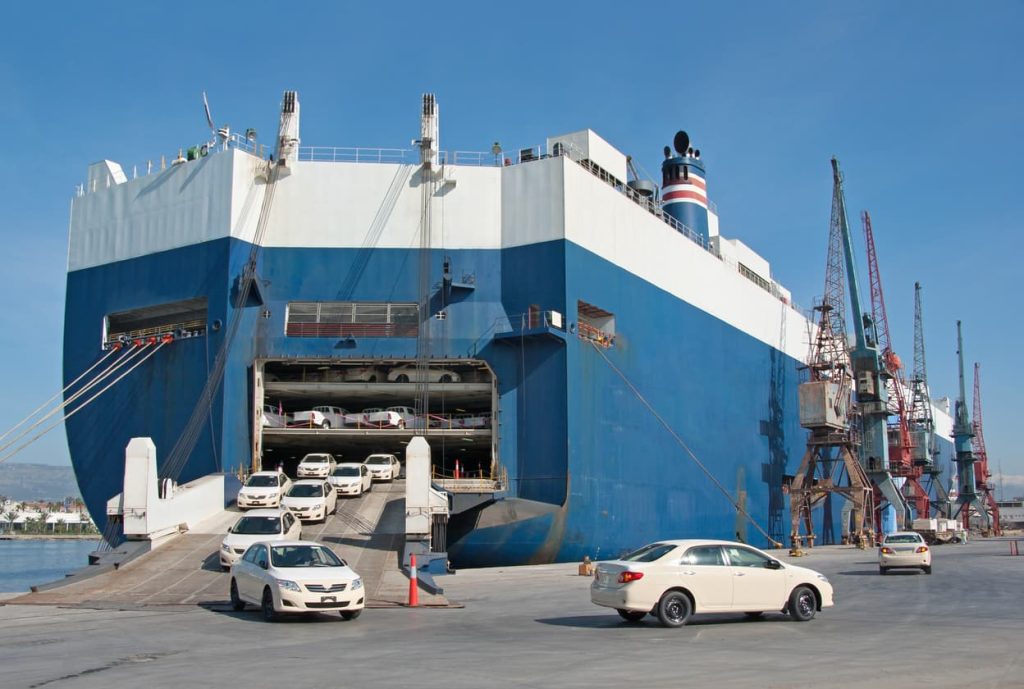 cars leaving the boat after roll-on/roll-off international car shipping