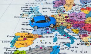 A toy car on a map of Europe