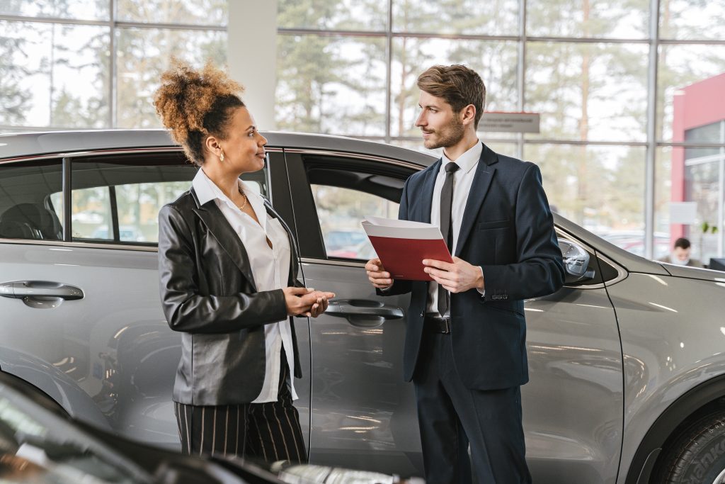 A woman buying a car