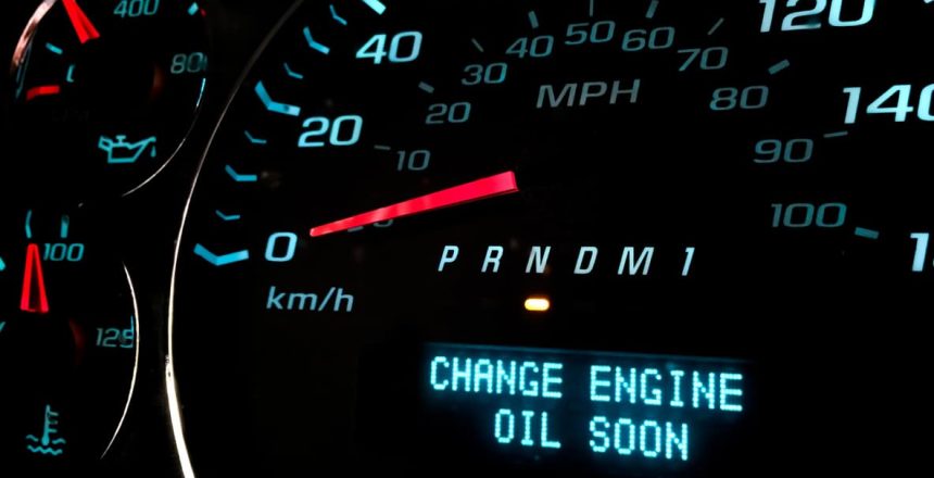 Dashboard text alert reading “Change engine oil soon.”