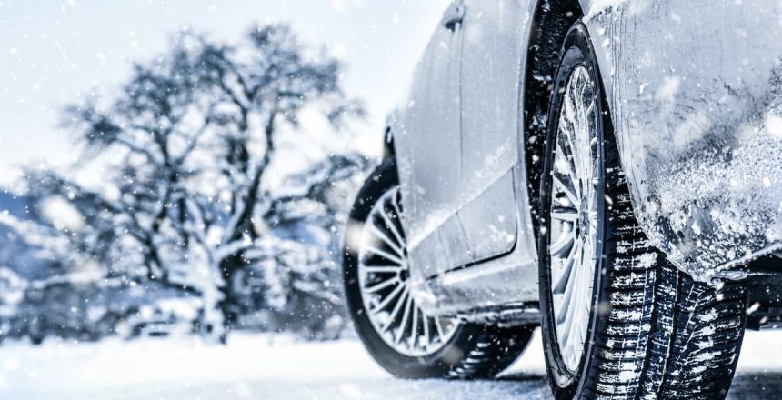 Close-up of car tires in snowy weather