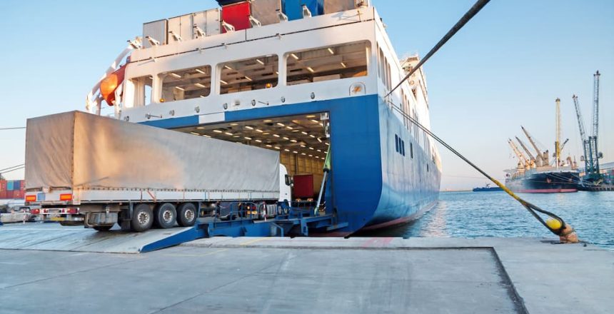 cars being unloaded from a docked roll on/roll off ship of a car transport international company.