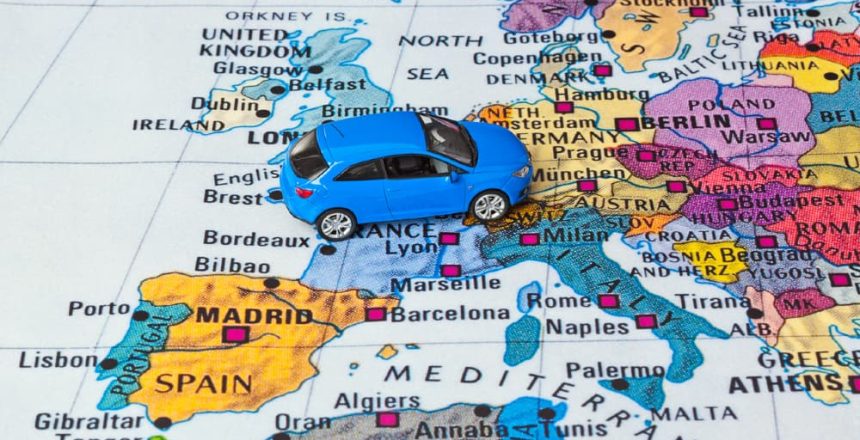 A toy car on a map of Europe