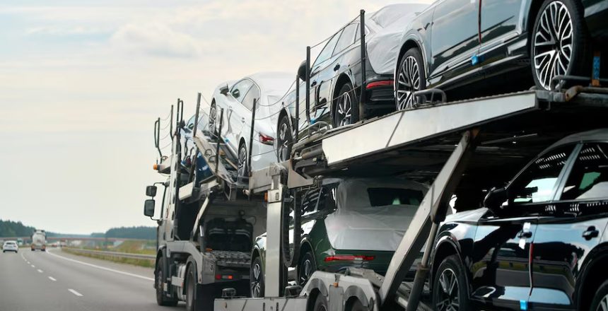 Two level car hauler with new SUVs on bed