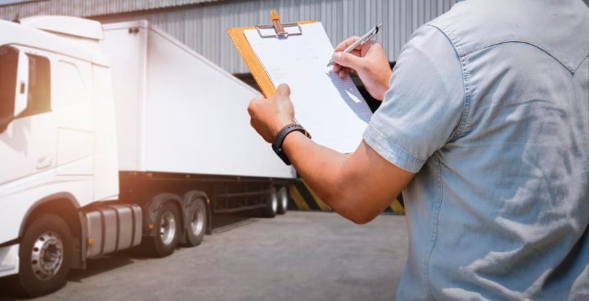 worker-holds-clipboard-controlling-loading-cargo-into-shipping-containers-logistics-trucks_36860-1812
